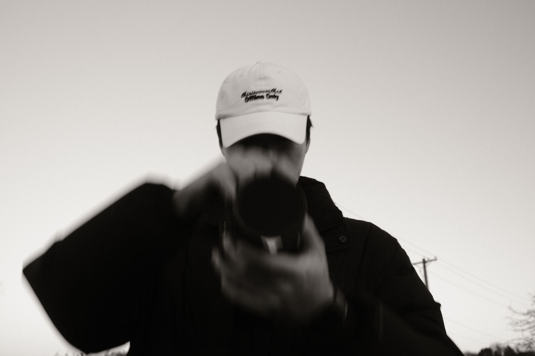 Photographer holding a camera, black and white