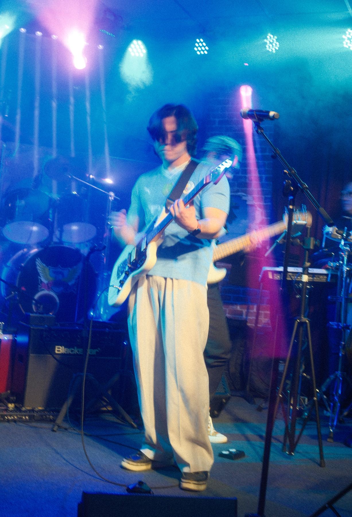 Band on a blue-lit set