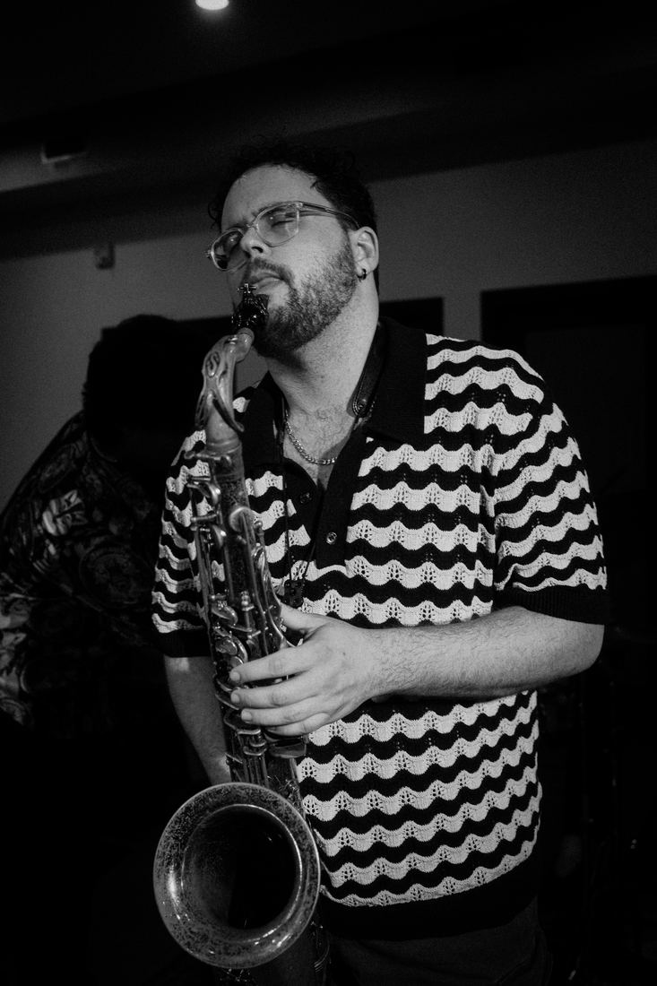 Saxophonist in a zigzag shirt, black and white