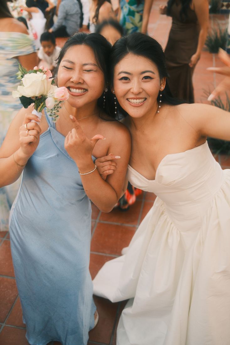 Bride laughing with a friend